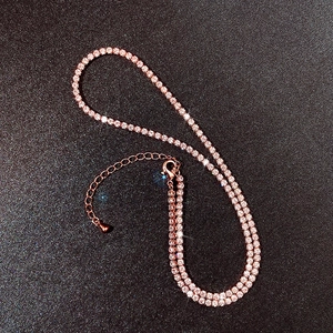 Macro shot of rose gold necklace with AAA cubic zirconia pavé and lobster clasp detail