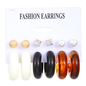 6-piece set of resin hoop earrings and studs with pearls on a white display card