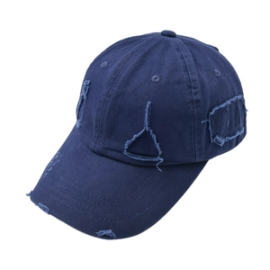 Distressed navy blue cotton baseball cap with ripped details and vintage washed finish