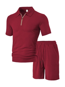 Detailed view of burgundy waffle knit texture on men's polo shirt and shorts set