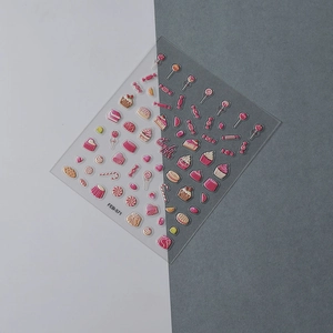 Detail of pink candy and cake embossed 3D nail stickers on dual-tone background