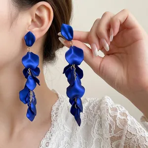 French style dark blue petal tassel drop earrings shown on a model with elegant matte finish