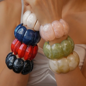 Colorful chunky acrylic link bracelets featuring marble textures and vibrant matte finishes