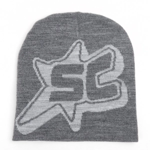 Detail of grey knitted beanie with star logo jacquard pattern and premium wool texture