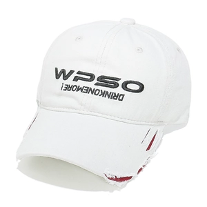 Detailed view of white baseball cap with distressed brim, red lining and black embroidery