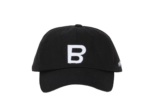 Detailed view of white letter B patch embroidery on black cotton canvas baseball cap