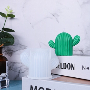 Macro detail of ribbed cactus silicone mold and finished green scented wax candle