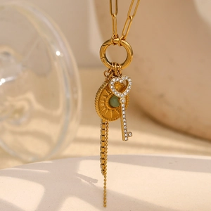 18K gold plated paperclip chain necklace with green stone sunburst and heart key charm