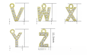 Close-up of gold-plated alphabet pendants V-Z with micro-paved cubic zirconia gems