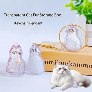 Transparent cat-shaped fur storage capsule with gold keychain for pet memorial keepsake