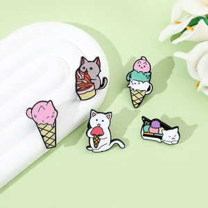 Five cute cartoon cat enamel pins featuring kittens with ice cream on a soft green background