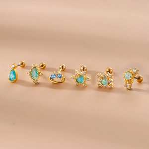 Blue zircon gold studs with teardrop moon and sun designs in stainless steel