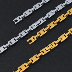 Detailed macro view of 18K gold and silver plated rectangular chain links for necklaces