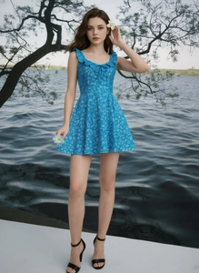 Detailed ruffled V-neckline and waist of a blue floral sleeveless summer dress