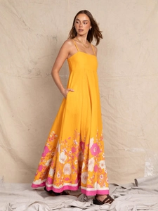 Floral print yellow maxi dress with spaghetti straps for beach vacations and summer wear