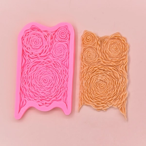 Pink silicone rose texture mold for DIY fondant cakes and baking showing detailed floral patterns