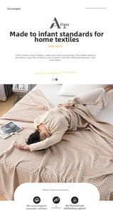 Detail of beige waffle weave cotton blanket showing soft texture and A-grade fabric quality