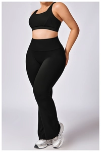 Detailed view of high-waist flared yoga pants and racerback sports bra in black