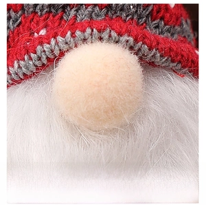 Detailed view of Christmas gnome showing knitted red hat and soft white faux fur beard