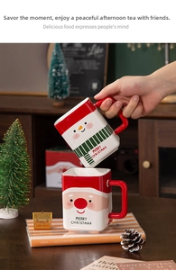 Macro detail of square ceramic Christmas mug with festive snowman pattern and red handle