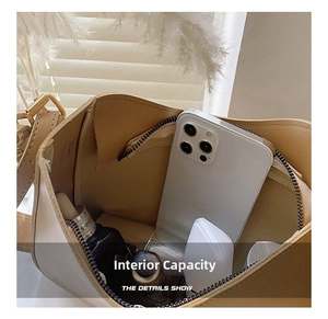 Spacious interior of minimalist beige tote bag showing large capacity for daily items