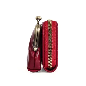 Red PU leather wallet with zipper and brass clasp closure in a side view