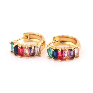 Detail of gold hoop earrings with multi-colored rectangular zircon stones inlay