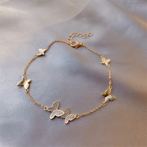 Detailed view of a gold-plated adjustable bracelet featuring five micro-set zircon butterflies