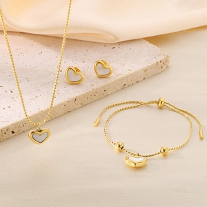 Elegant gold shell heart jewelry set including necklace, earrings and adjustable bracelet
