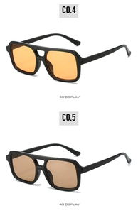 Detail view of square pilot sunglasses in orange and light brown tints at 45-degree angle