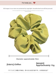 Detail view of 18cm light green chiffon scrunchie showing fabric texture and large size