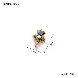 Detailed size view of a gold four-leaf clover pendant with black zircons, 1.6cm x 0.9cm