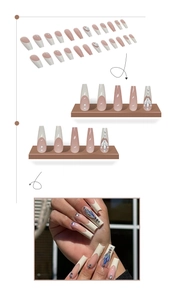 Detailed view of long coffin press on nails featuring French tips with pearls and crystals