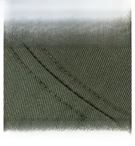 Detail of army green cotton fabric with high-quality double stitching and twill texture