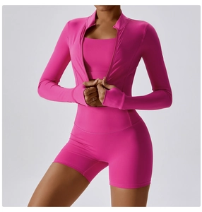 Hot pink yoga set featuring high-waist shorts, sports bra, and thumb-hole zipper jacket