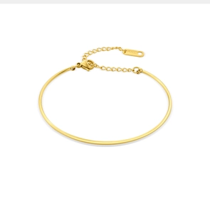 Detail of adjustable gold stainless steel bracelet chain with S.STEEL hallmark tag