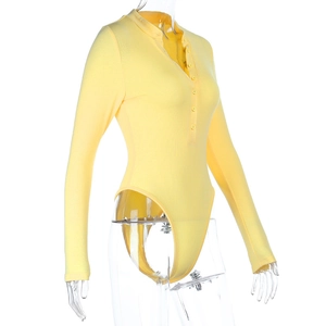 Detail view of yellow ribbed knit bodysuit featuring long sleeves and buttoned V-neckline