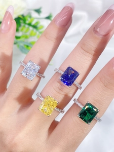 Macro view of four S925 sterling silver rings featuring colorful rectangular ice-cut stones