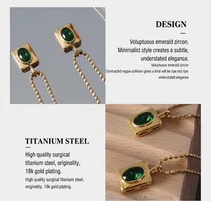 Detail of 18K gold plated titanium steel necklace with emerald zircon pendant