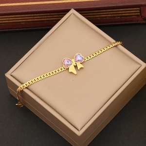 Fashionable golden stainless steel bow necklace with a purple heart crystal pendant on gift box