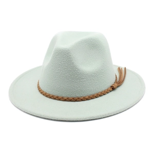 Detail of mint green wool fedora hat featuring a brown braided leather band and tassels