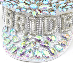 Macro detail of bride captain hat featuring white pearls and iridescent AB rhinestones