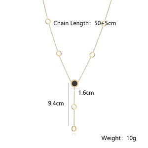 Detailed view of gold Y-shaped fringe necklace with Roman numerals and size specs