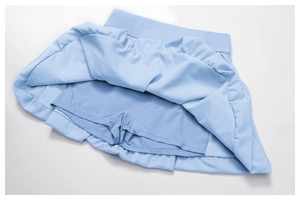 Detail view of light blue skort showing breathable mesh inner shorts and elastic waistband