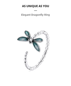 Detail of s925 silver dragonfly ring with blue enamel wings and sparkling zircon stone