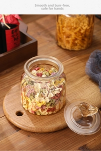 Macro view of amber glass storage jar with heart lid and vertical ribbed texture
