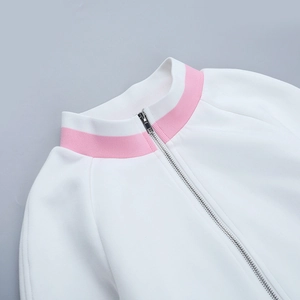 Close-up of white zip-up sweatshirt featuring a pink striped stand collar and silver zipper