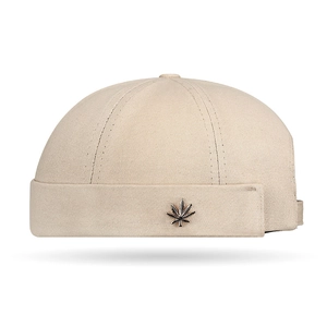 Retro khaki Miki Hat docker cap with metal leaf emblem for street style and hip-hop