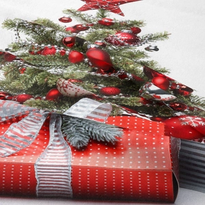 Close-up of Christmas tree and red gift box print on woven polyester fabric texture