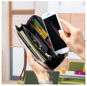 Pink leather wallet interior with multiple slots for cards, cash, and smartphone storage
